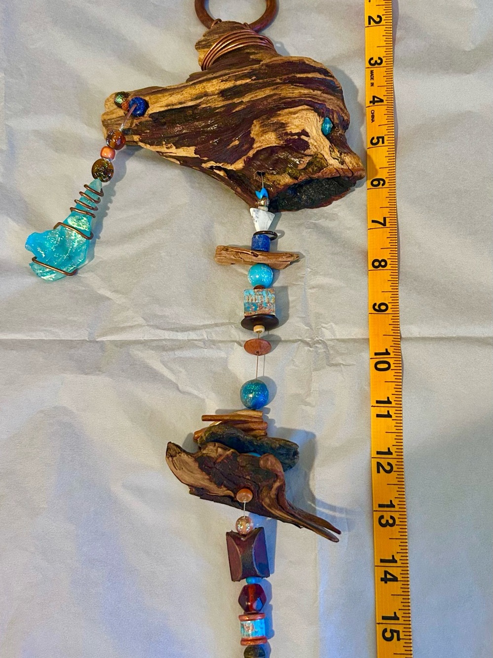 Handcrafted drifted beaded wall hanging decor.